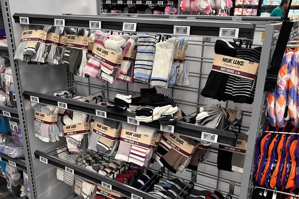 Electronic shelf labels installed on supermarket gondola shelving showing e-ink price displays